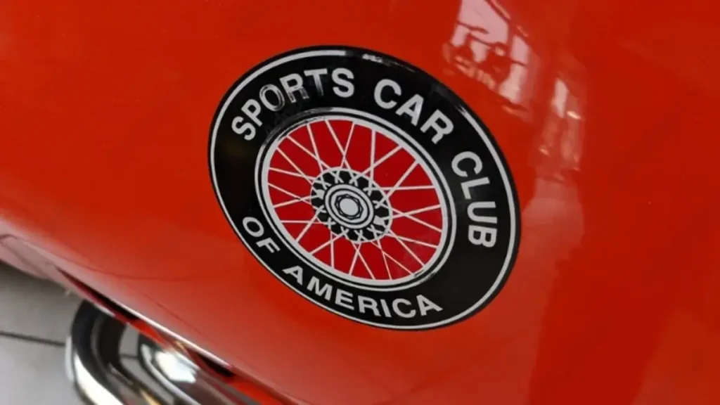 sports car club of america logo and sign text on side of luxury racing car in scca us